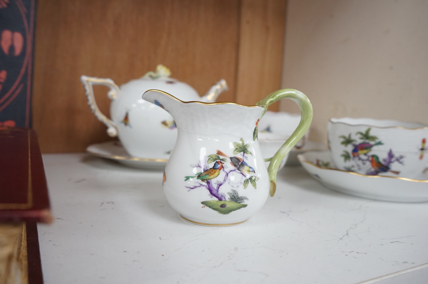 A Herend porcelain Rothschild Birds pattern tête-à-tête tea service, decorated with birds and butterflies. (8 piece's) teapot 10cm high